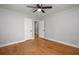 Bedroom with hardwood floors, ceiling fan, and doorways leading to other rooms at 1248 Sumner Ave, North Charleston, SC 29406