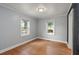 Bedroom features hardwood floors and natural light from two windows at 1248 Sumner Ave, North Charleston, SC 29406