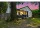 Charming exterior of the house featuring a porch, swing, and well-lit landscape at dusk at 1248 Sumner Ave, North Charleston, SC 29406