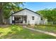 A cozy single-Gathering home with a quaint front porch, manicured lawn, and inviting walkway at 1248 Sumner Ave, North Charleston, SC 29406