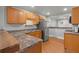 Kitchen featuring stainless steel refrigerator, wood cabinets, and wood floors at 1248 Sumner Ave, North Charleston, SC 29406