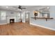 Comfortable living room with fireplace, hardwood floors, and open access to the kitchen at 1248 Sumner Ave, North Charleston, SC 29406