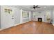 Sunlit living room featuring wood floors, a fireplace, and a hanging chair at 1248 Sumner Ave, North Charleston, SC 29406