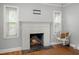 Cozy living room with a white brick fireplace and a hanging boho chair at 1248 Sumner Ave, North Charleston, SC 29406