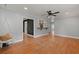 Light-filled living room with wood floors, ceiling fan, and decorative furnishings at 1248 Sumner Ave, North Charleston, SC 29406