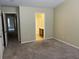 Bedroom featuring neutral walls and carpet with bathroom access at 126 Woodward Rd, Goose Creek, SC 29445