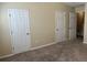 Neutral bedroom with carpet and multiple closet and doorway access points at 126 Woodward Rd, Goose Creek, SC 29445