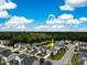 Aerial view of a beautiful house in a neighborhood with a pond at 1301 Wild Goose Trl, Summerville, SC 29483