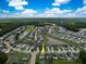 Aerial view of home in a suburban neighborhood with a pond at 1301 Wild Goose Trl, Summerville, SC 29483