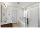 Bright bathroom featuring a large tub with shower, vanity, and modern fixtures at 1301 Wild Goose Trl, Summerville, SC 29483