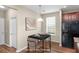 Dining area features modern table setting, window, and view of kitchen area at 1301 Wild Goose Trl, Summerville, SC 29483