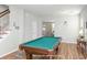 View of a game room from the living room, featuring a pool table and seamless open-concept design at 1301 Wild Goose Trl, Summerville, SC 29483