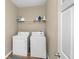 Laundry room with washer, dryer, and shelving at 1301 Wild Goose Trl, Summerville, SC 29483