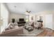Open-concept living room next to game room, offering wood floors, neutral walls, and a comfortable seating area at 1301 Wild Goose Trl, Summerville, SC 29483