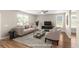 Living room featuring neutral walls, hardwood floors, a ceiling fan, and lots of natural light at 1301 Wild Goose Trl, Summerville, SC 29483