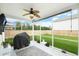 Screened porch featuring an outdoor rug, ceiling fan, and views of a fenced backyard at 1301 Wild Goose Trl, Summerville, SC 29483