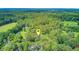 Aerial view of a private home surrounded by a dense forest, marked with a locator pin at 142 Maxwell Rd, Summerville, SC 29483