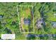 Aerial view shows the property's boundaries and landscaping at 142 Maxwell Rd, Summerville, SC 29483