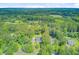 Aerial view of property featuring lush surroundings with a home nestled among mature trees at 142 Maxwell Rd, Summerville, SC 29483