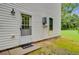 Exterior view of home featuring a back door and hot water system at 142 Maxwell Rd, Summerville, SC 29483
