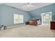 Bedroom with vaulted ceilings, a large window, and a bed with blue and white bedding at 142 Maxwell Rd, Summerville, SC 29483