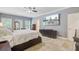 Bright bedroom with a ceiling fan, TV, and tile flooring at 142 Maxwell Rd, Summerville, SC 29483