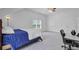 An airy bedroom with a bed, ceiling fan, workspace, and window for plenty of light at 142 Maxwell Rd, Summerville, SC 29483