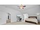 Large bedroom with a desk, ceiling fan, and an en suite bathroom through the door at 142 Maxwell Rd, Summerville, SC 29483
