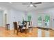 Bright dining room features hardwood floors and access to the backyard at 142 Maxwell Rd, Summerville, SC 29483