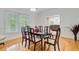 Formal dining room with hardwood floors, chair rail, and bright window at 142 Maxwell Rd, Summerville, SC 29483