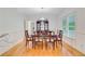 Traditional dining room with hardwood floors, china cabinet, and elegant chandelier at 142 Maxwell Rd, Summerville, SC 29483