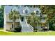 Beautiful home with a metal roof, lush landscaping, and a spacious covered porch, ideal for relaxing at 142 Maxwell Rd, Summerville, SC 29483