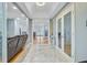 Welcoming foyer boasting tile flooring, glass french doors, and sightlines to the living spaces at 142 Maxwell Rd, Summerville, SC 29483