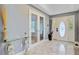 Spacious foyer area featuring marble floors, decorative glass door, and a glass table with statues at 142 Maxwell Rd, Summerville, SC 29483
