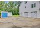 Spacious three-car garage offering plenty of parking and storage space with utility shed at 142 Maxwell Rd, Summerville, SC 29483