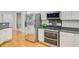 Well-equipped kitchen features stainless steel appliances and granite countertops at 142 Maxwell Rd, Summerville, SC 29483