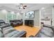 Cozy living room featuring hardwood floors, a ceiling fan, and a large screen TV at 142 Maxwell Rd, Summerville, SC 29483
