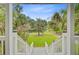 Scenic view from the covered porch showing lush landscaping and a glimpse of the neighborhood at 142 Maxwell Rd, Summerville, SC 29483