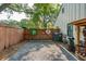 A backyard area with rustic decor, including vintage oil signs and a woodpile, adding character to the outdoor space at 1446 Burningtree Rd, Charleston, SC 29412