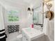 Modern bathroom features a vanity, mirror, stylish lighting, and neutral tones at 1446 Burningtree Rd, Charleston, SC 29412