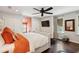 Bright bedroom with hardwood floors, ceiling fan, large windows, and stylish decor at 1446 Burningtree Rd, Charleston, SC 29412
