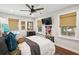 Comfortable bedroom with a ceiling fan, large windows, natural light, and window coverings at 1446 Burningtree Rd, Charleston, SC 29412