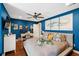 Bright bedroom with hardwood floors, ceiling fan, desk, and ample natural light at 1446 Burningtree Rd, Charleston, SC 29412