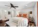 Charming bedroom with hardwood floors, ceiling fan, and elegant furnishings at 1446 Burningtree Rd, Charleston, SC 29412
