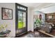 Bright entryway with wood floors, natural light, and a glimpse of the living room beyond at 1446 Burningtree Rd, Charleston, SC 29412