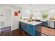 Charming kitchen with blue island, white cabinetry, stainless appliances, and modern countertops at 1446 Burningtree Rd, Charleston, SC 29412