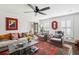 Bright living room with ample seating, large area rug, and charming decor at 1446 Burningtree Rd, Charleston, SC 29412