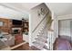 Inviting foyer with staircase featuring patterned runner, living room, and hardwood floors at 1446 Burningtree Rd, Charleston, SC 29412