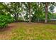 Spacious backyard with mature trees and privacy fence at 1552 Harborsun Dr, Charleston, SC 29412