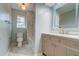 Stylish bathroom with a lighted mirror, modern vanity and a toilet and bathtub at 1552 Harborsun Dr, Charleston, SC 29412